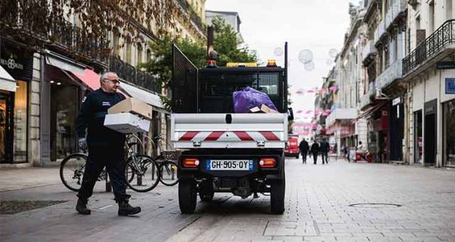 Tipper in a town centre